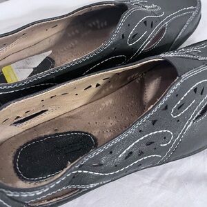 Stylish Navy Blue Slip-On Shoes with White Accents